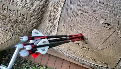 During field tests with the QAD UltraRest Integrate MX, the author shot tight groups. The one in the photo above was from 20 yards and resulted in a couple damaged nocks and vanes.