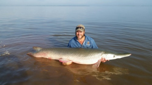 ODWC research biologist Richard Snow with an alligator gar, the focus of his ongoing research funded by the Wildlife and Sport Fish Restoration Program money via excises taxes paid by fishing tackle manufacturers. (Photo: ODWC)