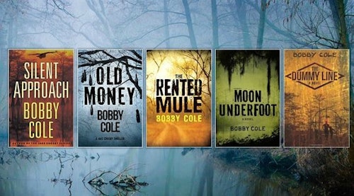 Bobby Cole has written five books, which are shown above in order of pub date, from right to left: “The Dummy Line” (2008), “Moon Underfoot” (2013), “The Rented Mule” (2014), “Old Money” (2016) and “Silent Approach” (2017). Three books are in a series, and two titles (“The Rented Mule” and “Silent Approach”) are not.