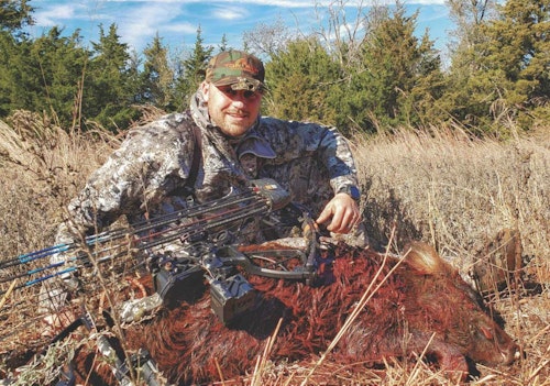The author with his first-ever wild hog, shot on the Canton WMA in northwest Oklahoma.