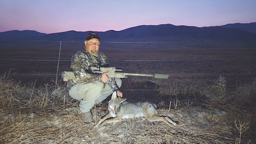 David Hillis poses with a last light, long-range coyote. Team David and Eric killed five coyotes the first day of the contest.