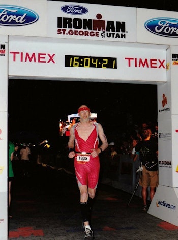 Bowhunter/athlete Dwight Schuh crossing an Ironman finish line.