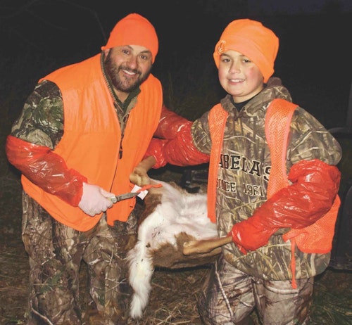 All gloved-up, Ralph and his son, RJ, get ready to field-dress RJ’s very first whitetail buck, which just so happened to be a button buck. The duo was thrilled!