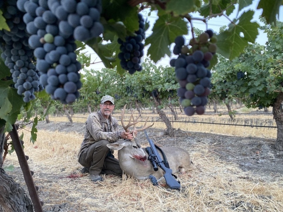 The author with his first-ever Columbia blacktail, a “cabernet buck” harvested on the Steinbeck Winery vineyard.