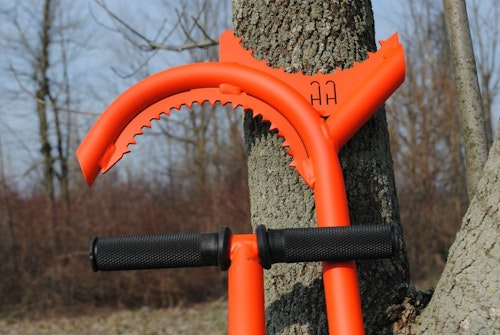 A tool such as a Habitat Hook works well to push or pull a hinge-cut tree to the ground.