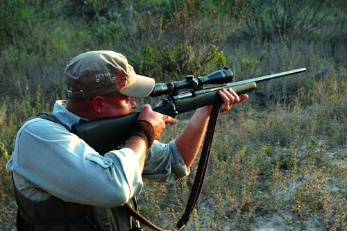 Offhand, you swing from knees, hips and shoulders. Arms and rifle track the target as a unit, no strain.​ (Photo: Wayne van Zwoll)