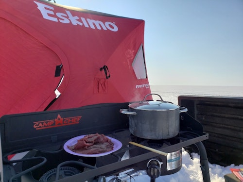 The Camp Chef Explorer two burner propane stove was the perfect height for cooking and dipping, and with two burners you could easily cook two different soups for a bit of variety. Photo: Mike Schoblaska