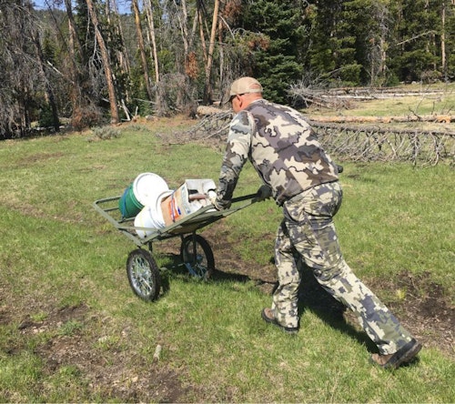 Hauling bait onto public lands that forbid motorized vehicles is a challenge. A cart such as the one shown here can also be used to haul out a bear if you’re successful.