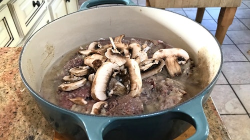 Brown the steaks before placing them in the Dutch oven. Make and add gravy, along with fresh mushrooms. Bake at 350 degrees for 1 hour. Photo: Amy Hatfield