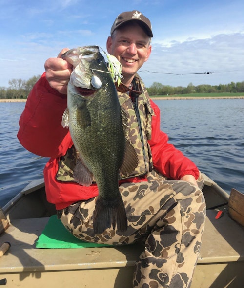 The author with a Minnesota spring largemouth caught on a main lake shoreline. The prespawn bass smoked a Northland Reed-Runner spinnerbait in color Whitetreuse.