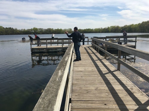 Minnesota panfish anglers practicing social distancing in early May on a public fishing dock.