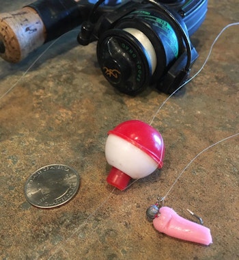 An ultralight rod-and-reel combo rigged with a small bobber and tiny leadhead jig tipped with nightcrawler is all you need for fast action. In this photo, the author used a pink soft plastic to illustrate the size crawler chunk recommended, as well as the preferred rigging method.