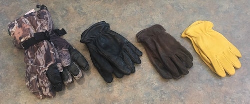 Because weather conditions change dramatically throughout deer season, you should own a variety of hunting gloves with different insulation qualities. The author’s favorites are shown here. The camo gloves are the warmest, followed by insulated deer skin gloves (black). In warm conditions, he’ll wear non-insulated deer skin gloves (dark brown). Note: Light-tan deer skin gloves (far right) are too bright for deer hunting; when hit by the sun, these gloves shine and will alert nearby whitetails.