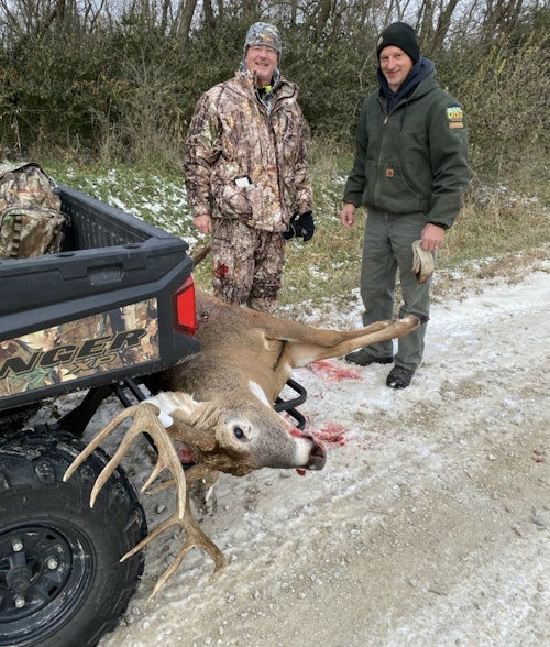 The author’s Iowa host and friend, Mike Everhart, and Park Ranger Craig Oberbroeckling, helped load the massive buck onto Everhart’s side-by-side.