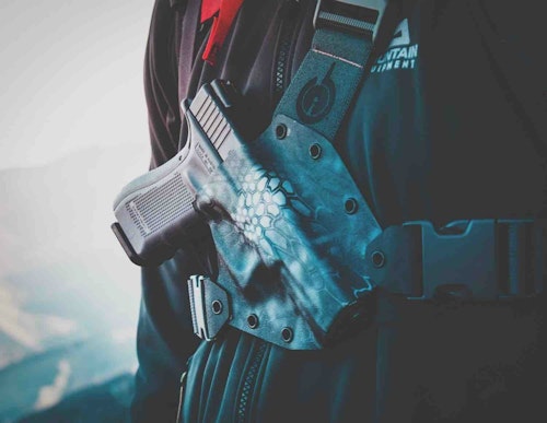 The author keeps his handgun easily accessible in a Kenai Chest Holster.