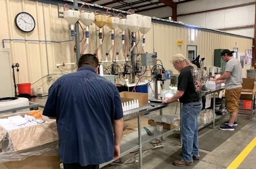 Pradco Fishing employees in the company's Fort Smith, Arkansas, facility making hand sanitizer for donation.
