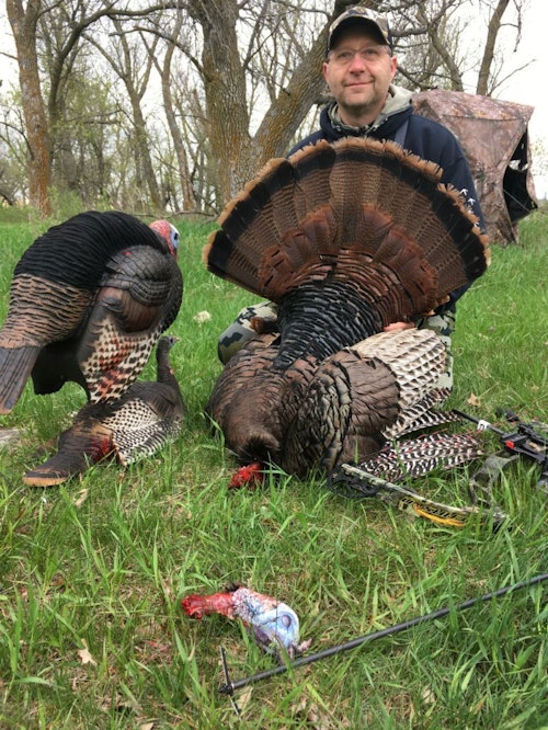 The author’s hunting buddy used a head/neck broadhead to drop this gobbler in its tracks. The tom was bumping the decoys at 5 yards when the arrow flew.