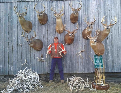 Scott Buckley proudly displays his growing collection of shoulder mounts and sheds taken from his new residence in Iowa.