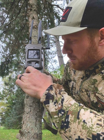 The author setting up the Cuddeback CuddeLink network for monitoring whitetail movement.