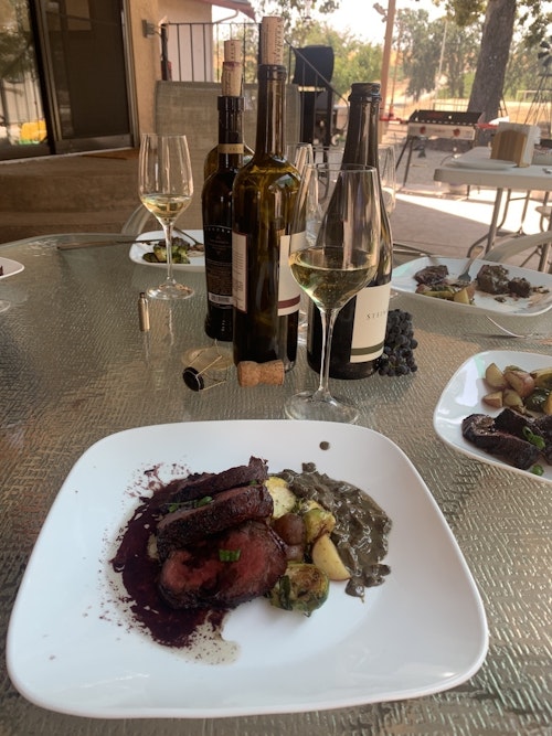 What could be better than a venison steak dinner paired with wine from the very grounds where both were harvested?