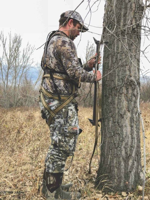 It's prohibited to use screw-in treesteps on most public lands, so deer hunters must learn how to quietly and safely use strap-on climbing sticks.