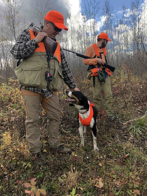 Federal’s Brian Kelvington and his springer Kuzko enjoy a short timeout in the woodcock covers.