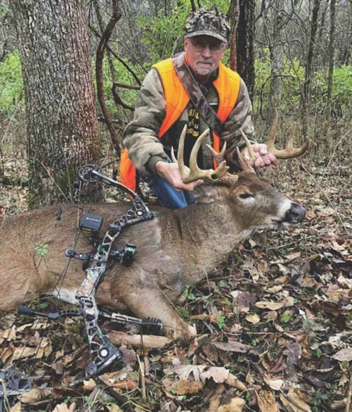 Having won the match of wits with a “run-of-the-mill, wild whitetail,” the author proudly displays his mature Kentucky buck. 