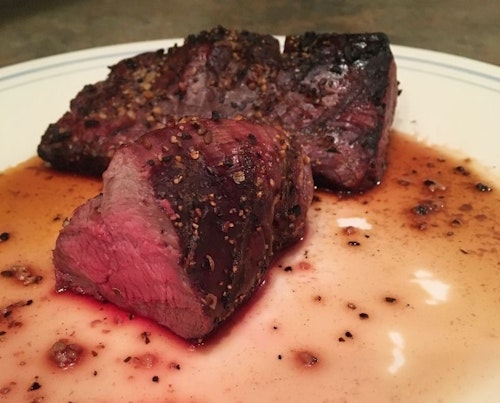 When cooking backstrap or tenderloins on the grill or in the pan, take great care not to overdo it. The author likes his steaks medium rare, just like the one shown here.