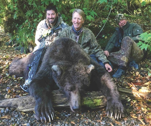 Hunter Doug Bing is flanked by assistant guide Craig Bisson and Master Guide Jim Boyce with Doug’s 8-foot, 9-inch brown bear. He took his bear at 28 yards after stalking up a salmon stream and wading through 11 other bears in 3 hours.