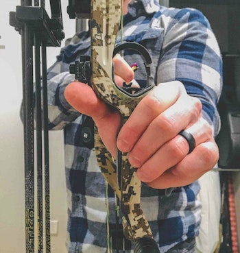 When gripping the bow, the less you involve your hand, the better. Bow torque — twisting the grip right or left, or up and down — will crush your accuracy.