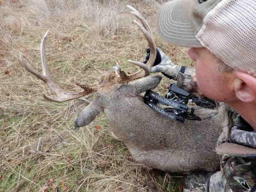 The author with a mature buck shot from a well-concealed hang-on treestand.