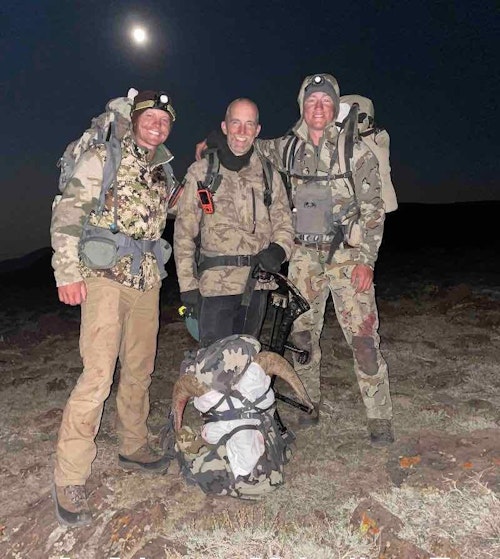 John Schaffer (center) celebrates his desert bighorn sheep success with his two young guides.