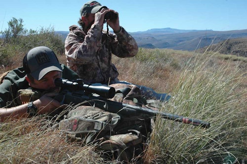 A soft pack helps this rifleman steady the rifle for a long shot. Rest the forend, never the barrel!