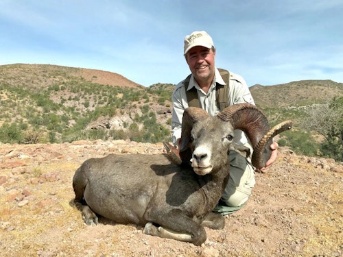 Dr. Wayne with the Desert Bighorn that completed his North American 29.