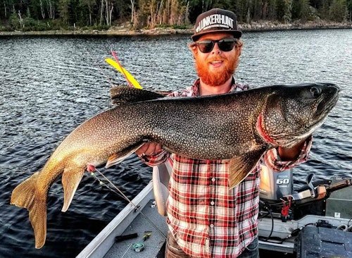 Windsor with an Aikens lake trout caught during one of his evenings off.